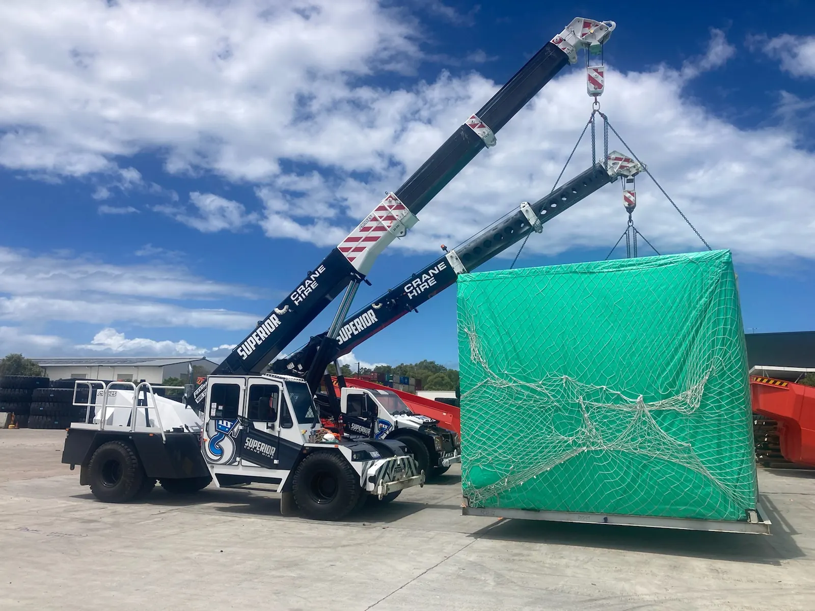 A Franna lifting a netted load