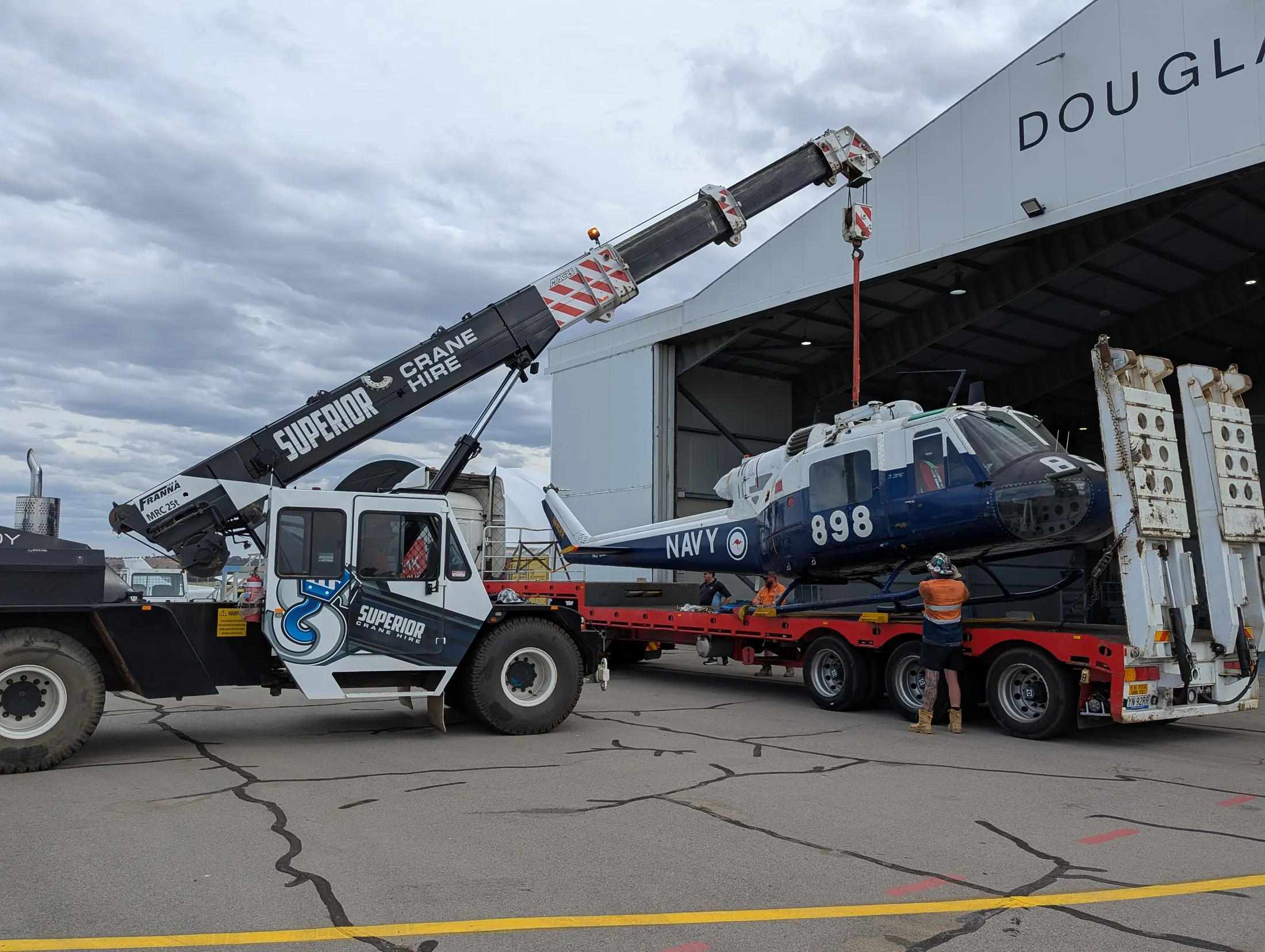 Superior crane lifting a helicopter into a hangar