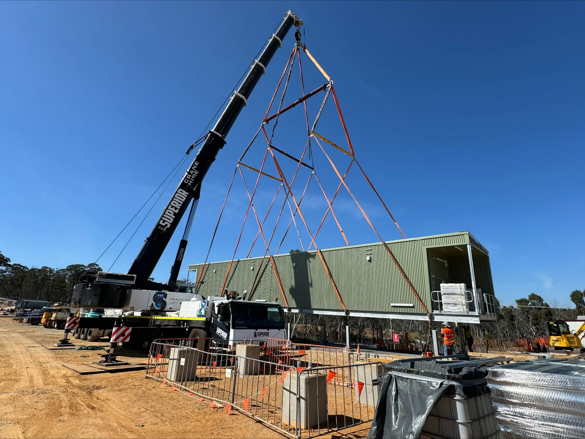 Crane placing building modules