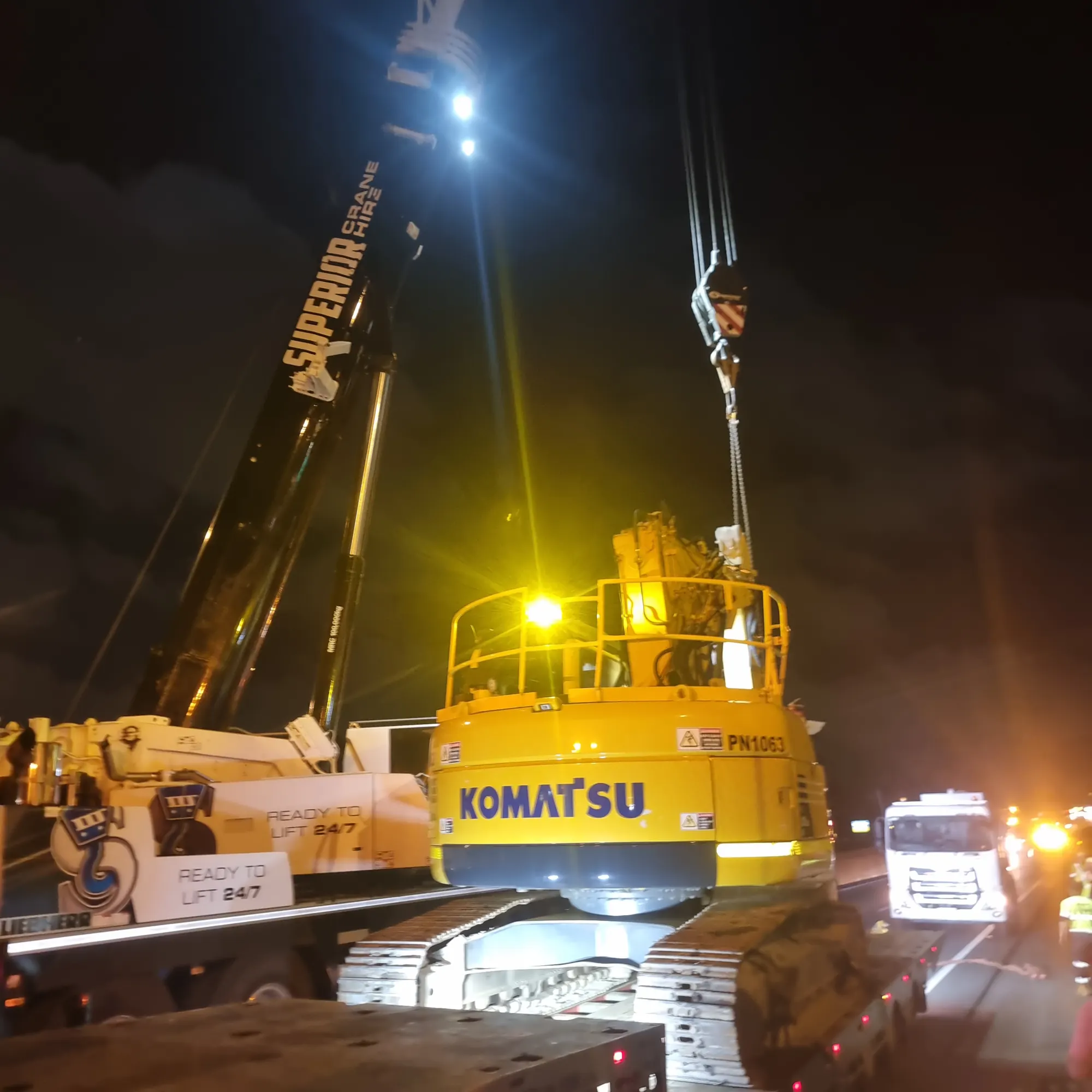 Night recovery of an excavator onto a truck
