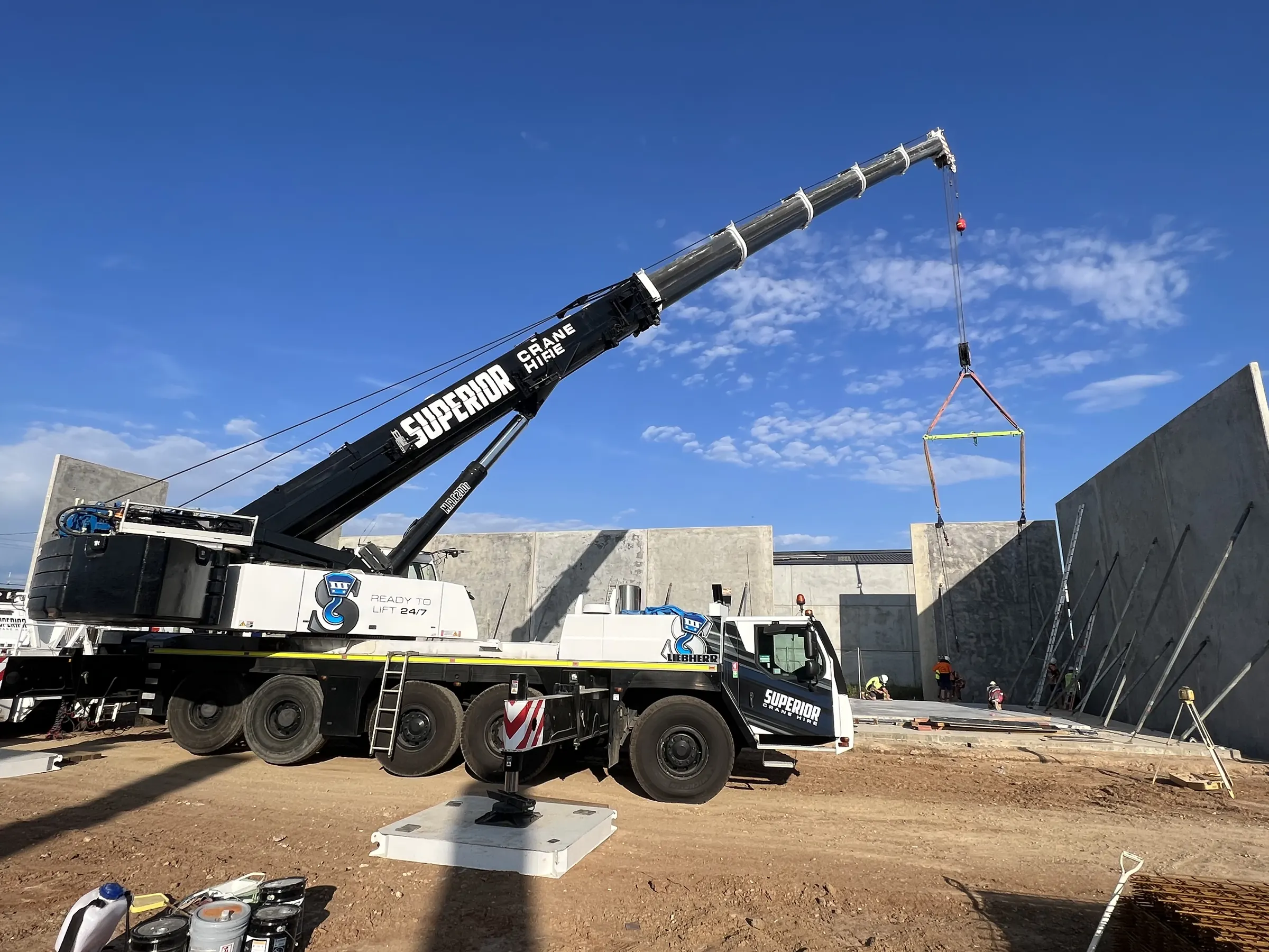 Liebherr crane standing a precast concrete panel