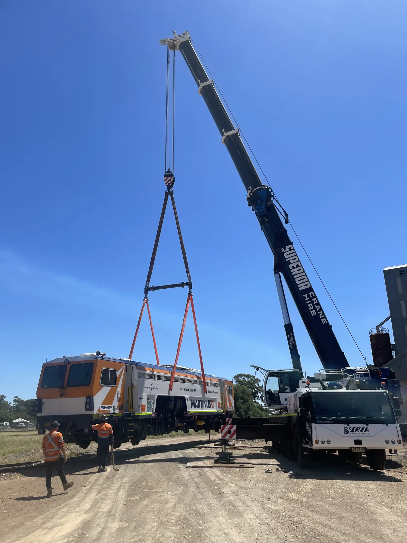 Liebherr crane lifting a locomotive