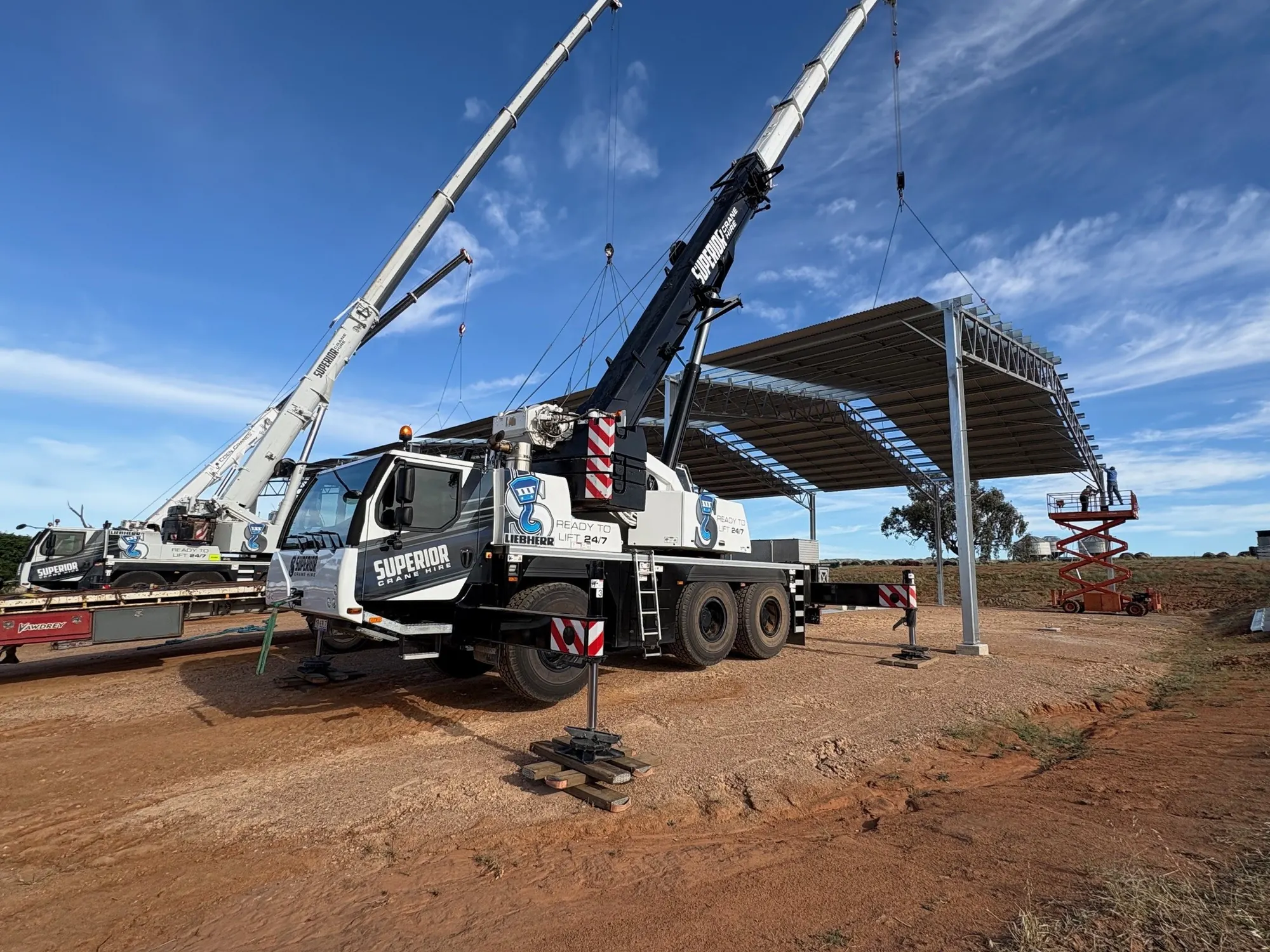 Superior crane lifting a steel shade structure