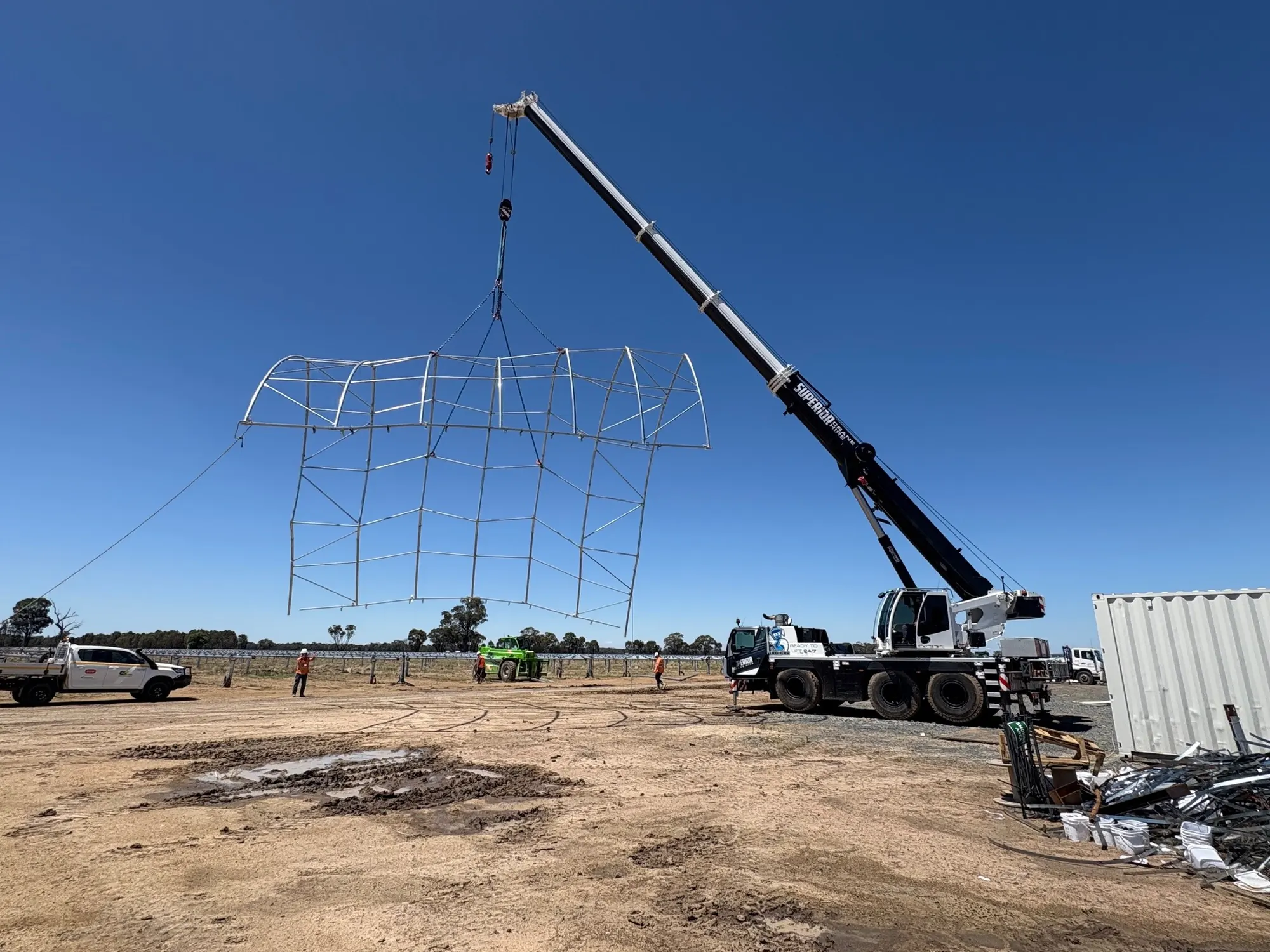 Crane lifting a large steel frame